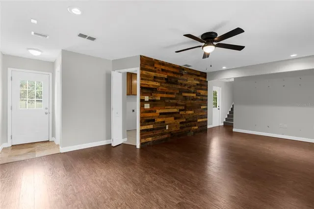a view of a backyard with wooden fence