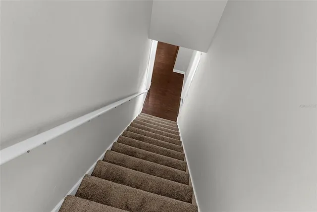 a view of a house with a yard and plants