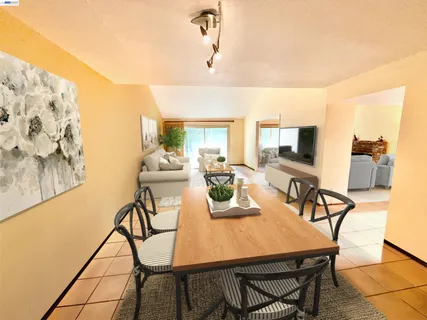 a view of hallway with stairs and wooden floor