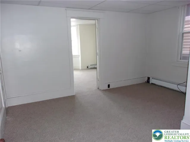 a view of entryway with wooden floor and stairs
