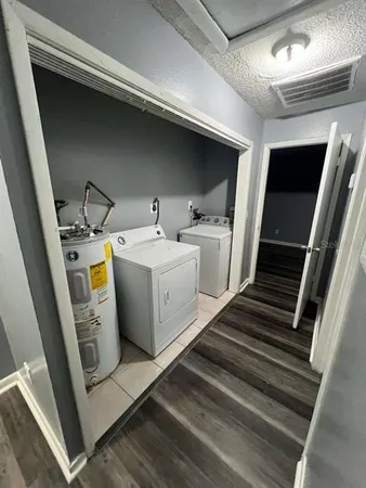 a utility room with dryer and washer