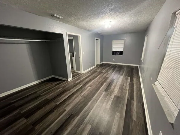 a view of backyard with hardwood