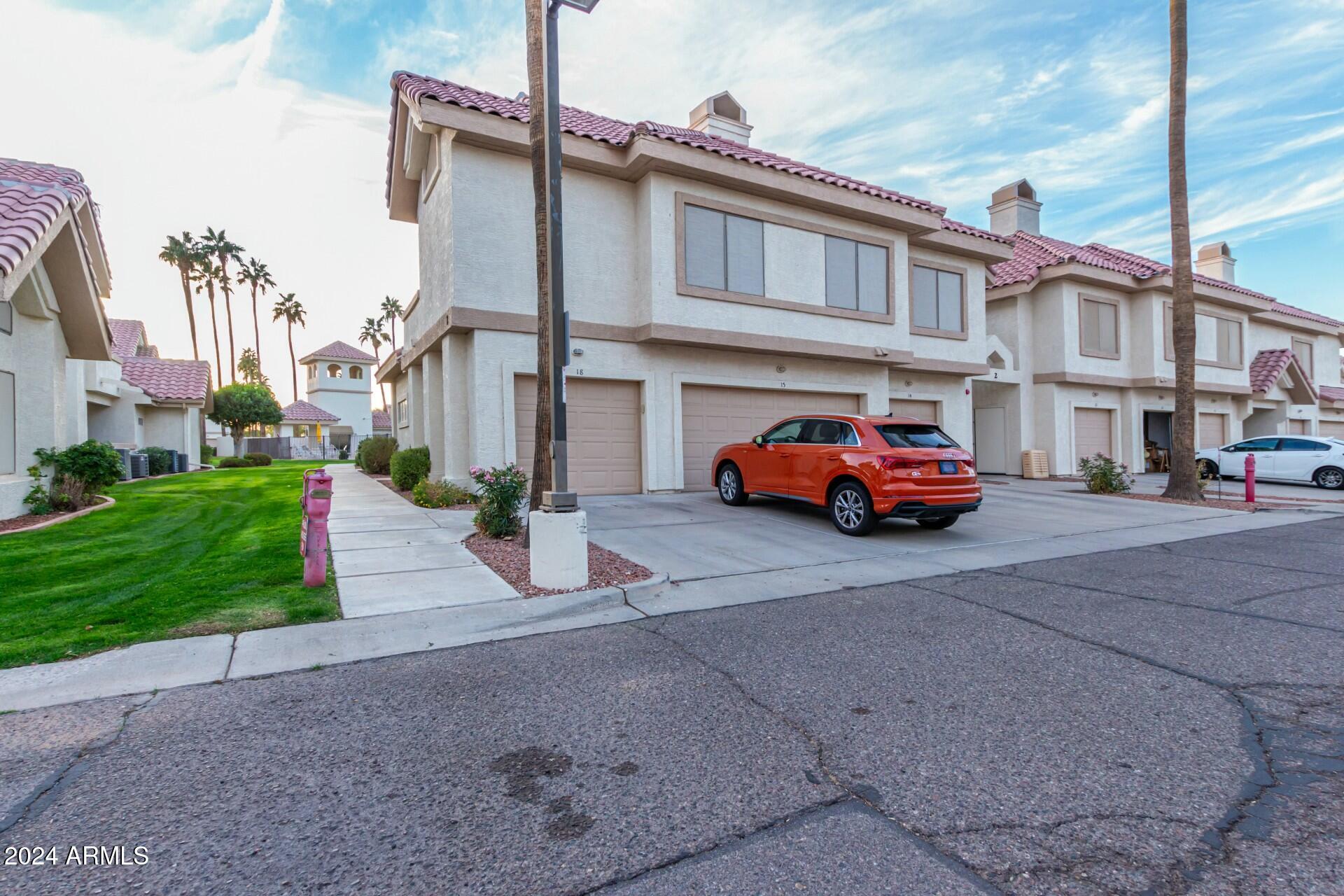 2801 North Litchfield Road, Unit 18 Goodyear, AZ 85395 - Photo 1 of 21 a car parked in front of a building