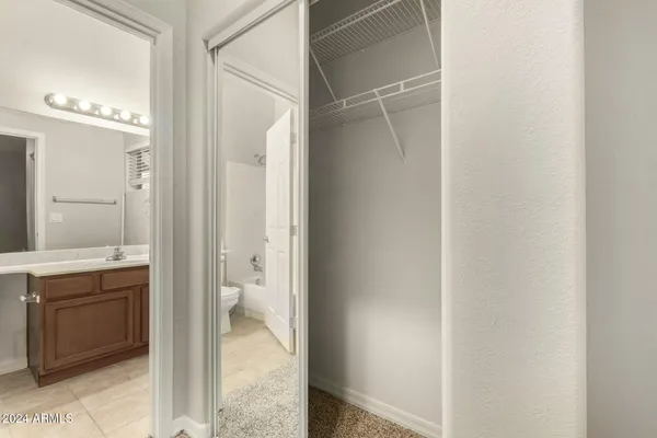 a bathroom with a glass shower door and a sink