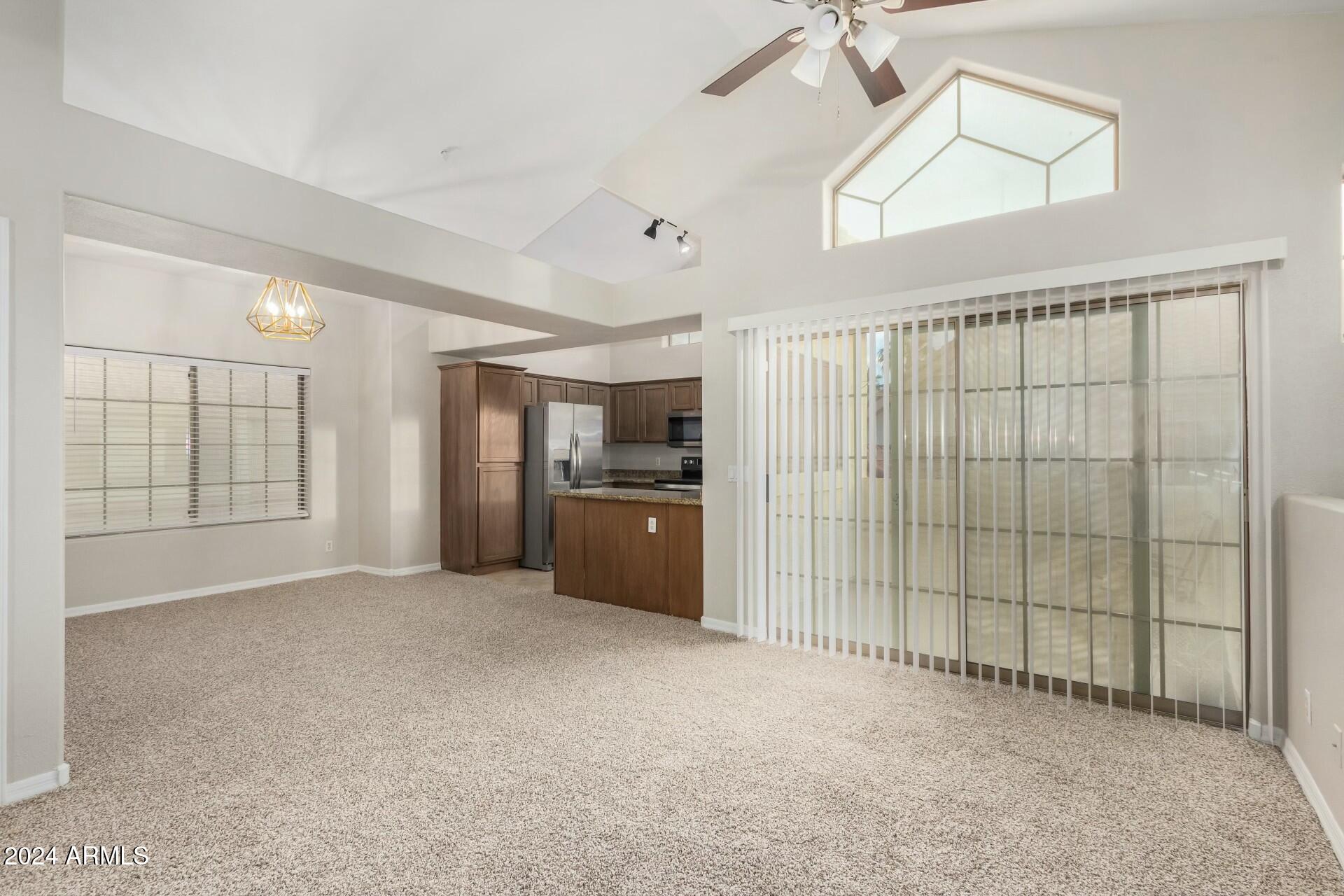 2801 North Litchfield Road, Unit 18 Goodyear, AZ 85395 - Photo 6 of 21 a view of an empty room with a window