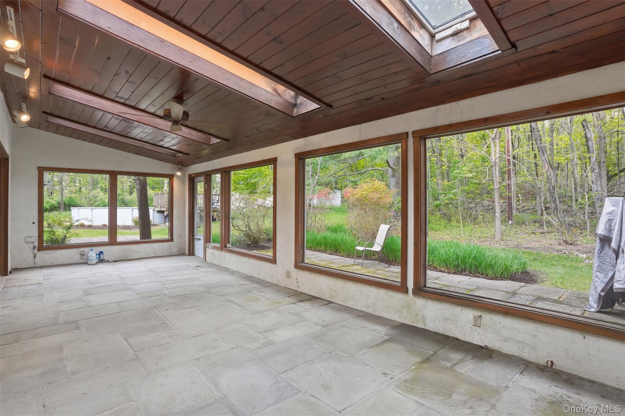 435 Samsonville Road Kerhonkson, NY 12446 - Photo 30 of 37 a view of an empty room with windows and city view