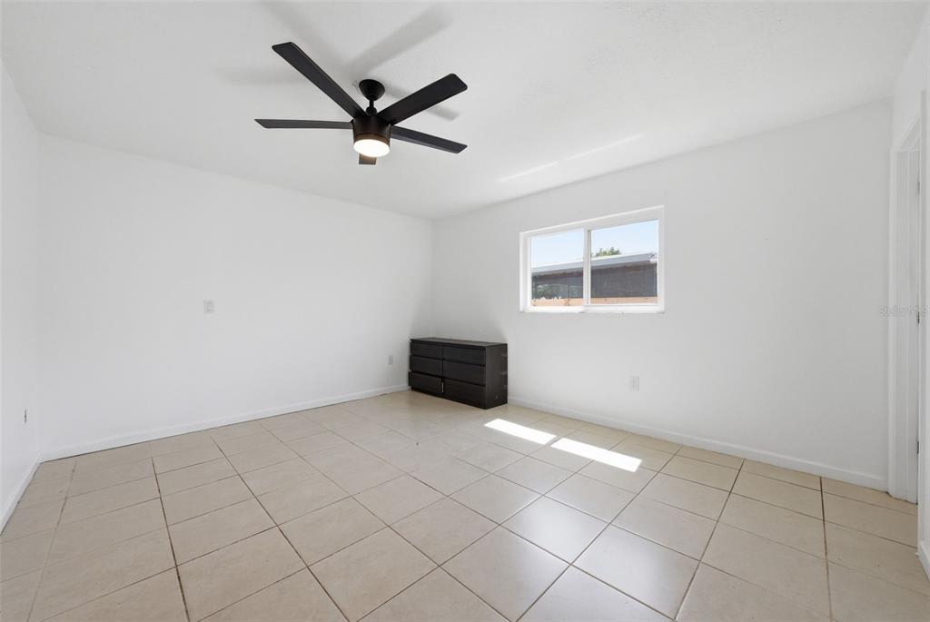 4536 Webber Street Sarasota, FL 34232 - Photo 18 of 45 a view of a livingroom with a ceiling fan and window