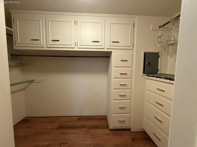 a view of cabinets and wooden floor