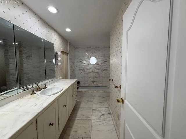 a bathroom with a double vanity sink and mirror