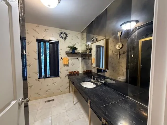 a bathroom with a shower and toilet