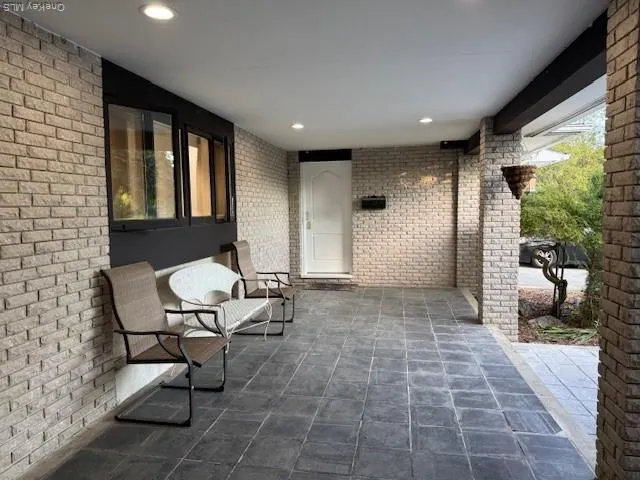 a living room with patio furniture