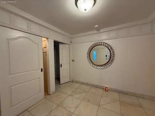 a view of a storage & utility room with racks on the wall