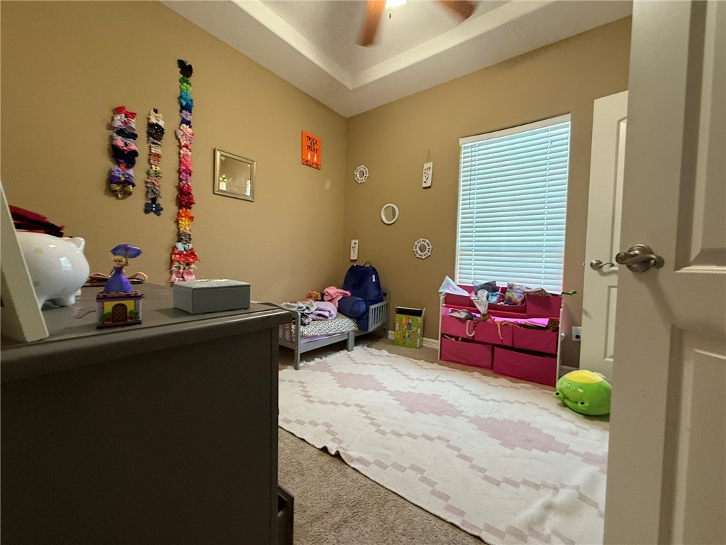 137 Lk Vw Terrace Three Rivers, TX 78071 - Photo 11 of 20 a bedroom with furniture and a window