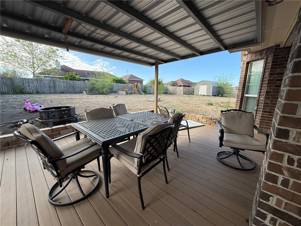 137 Lk Vw Terrace Three Rivers, TX 78071 - Photo 17 of 20 a view of a patio with table and chairs and couches with wooden floor