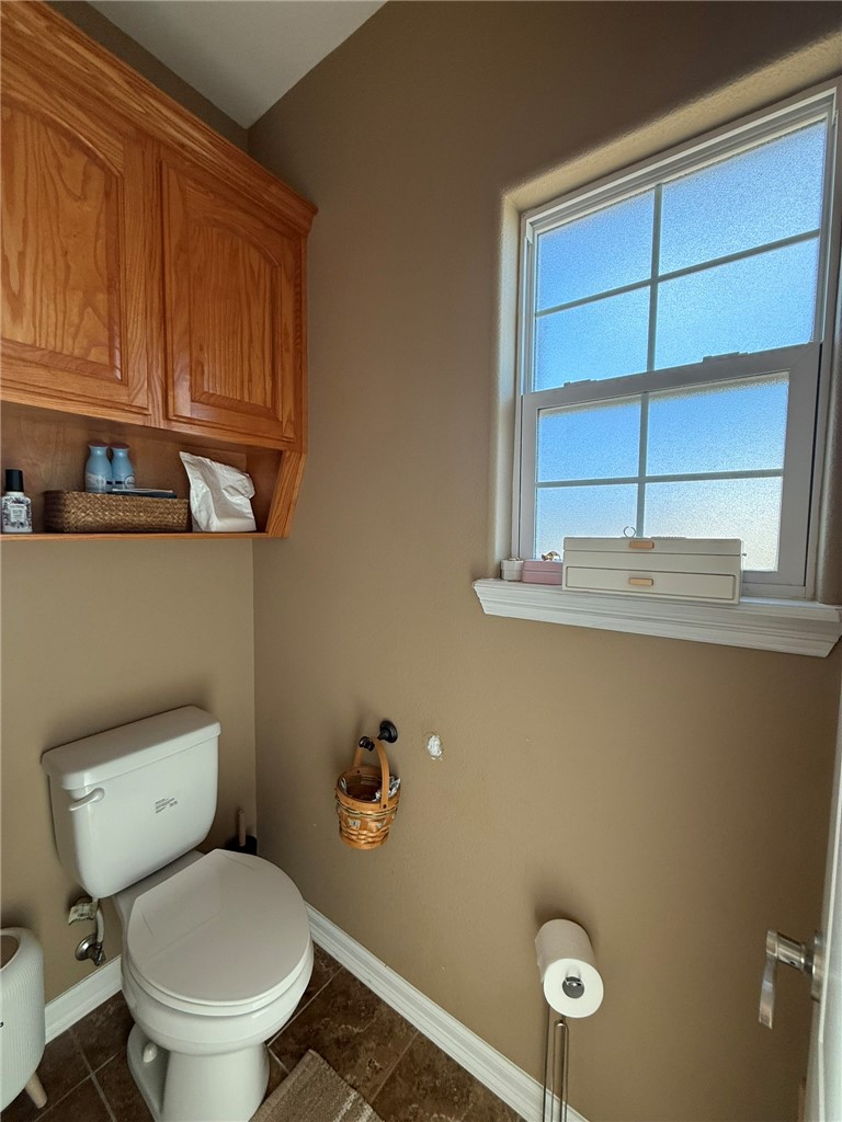 137 Lk Vw Terrace Three Rivers, TX 78071 - Photo 10 of 20 a white toilet sitting next to a window