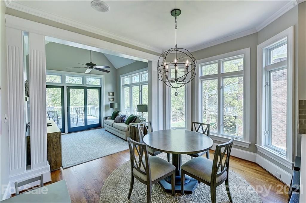 18731 River Falls Drive Davidson, NC 28036 - Photo 12 of 45 a view of a dining room with furniture wooden floor and chandelier