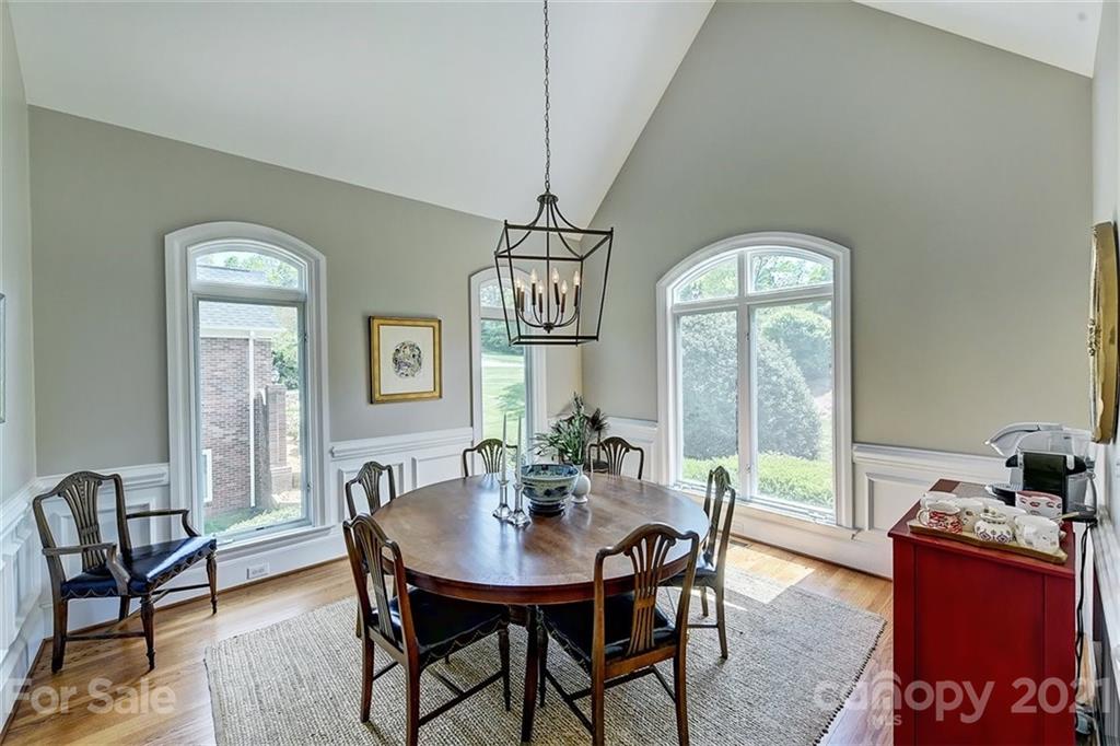 18731 River Falls Drive Davidson, NC 28036 - Photo 16 of 45 a view of a dining room with furniture window and outside view
