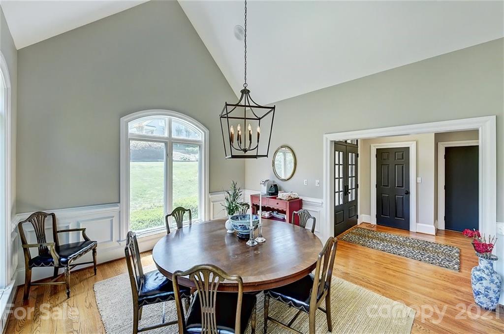18731 River Falls Drive Davidson, NC 28036 - Photo 17 of 45 a view of a dining room with furniture window and wooden floor
