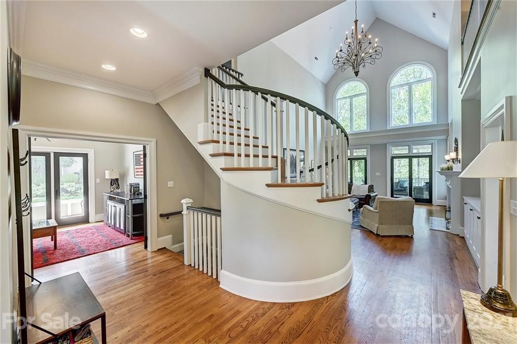 18731 River Falls Drive Davidson, NC 28036 - Photo 18 of 45 a living room with furniture and a chandelier