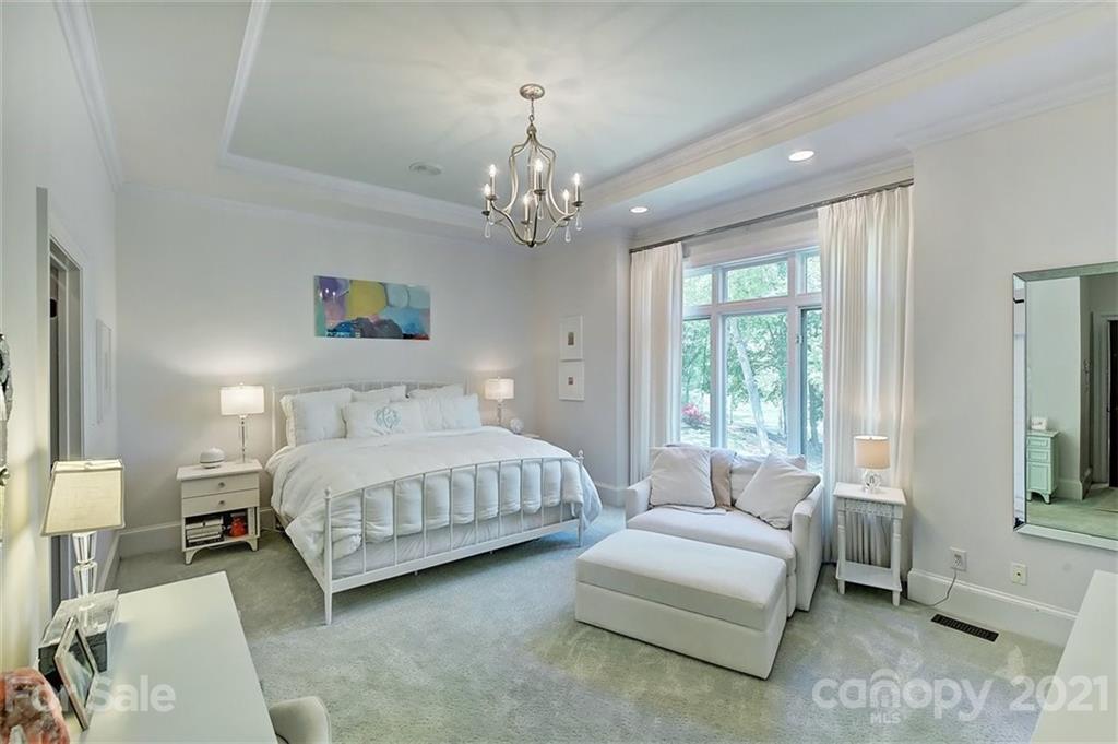 18731 River Falls Drive Davidson, NC 28036 - Photo 20 of 45 a spacious bedroom with a bed and a couch