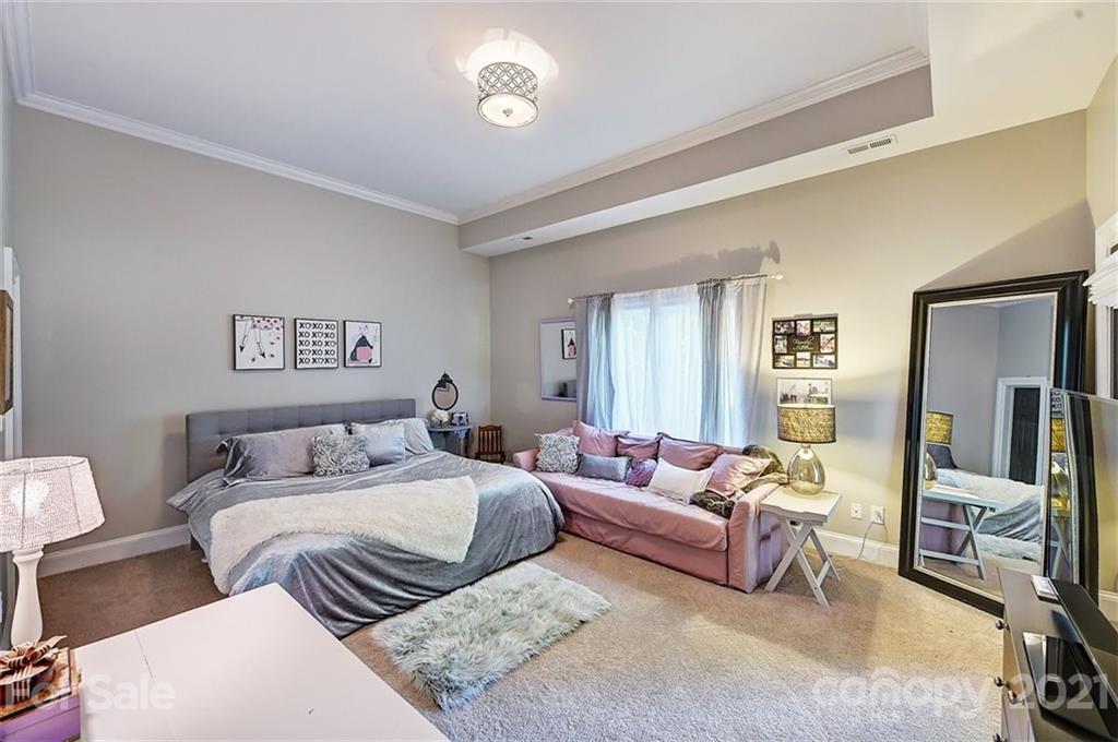 18731 River Falls Drive Davidson, NC 28036 - Photo 36 of 45 a bedroom with a bed and a couch