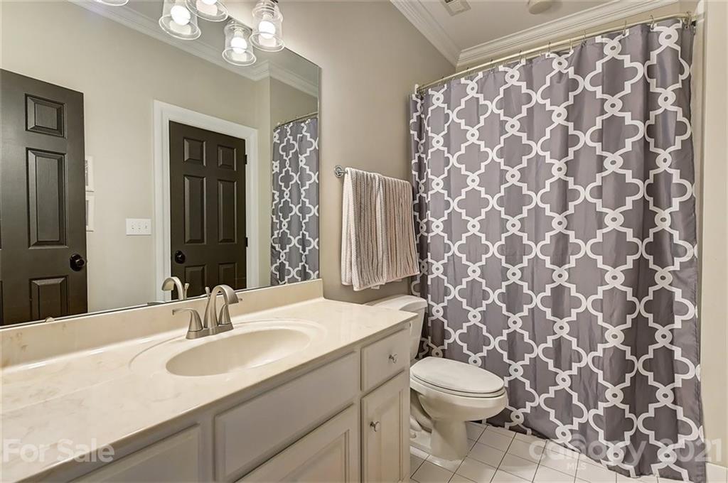 18731 River Falls Drive Davidson, NC 28036 - Photo 37 of 45 a bathroom with a sink and a mirror