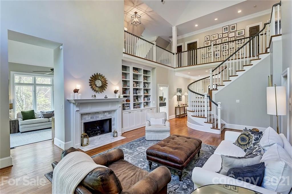 18731 River Falls Drive Davidson, NC 28036 - Photo 9 of 45 a living room with furniture and a fireplace
