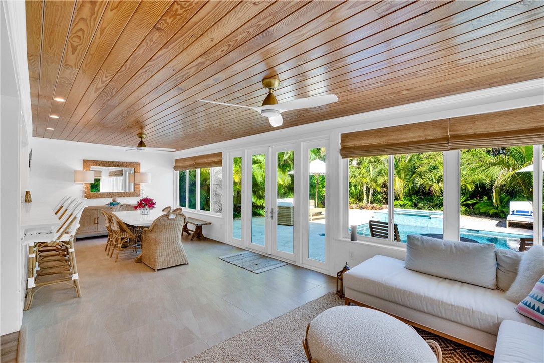 1830 East Sandpiper Road Vero Beach, FL 32963 - Photo 13 of 36 a living room with furniture and a large window
