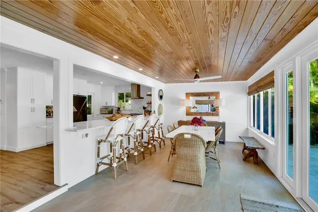 a view of a livingroom with furniture and a flat screen tv