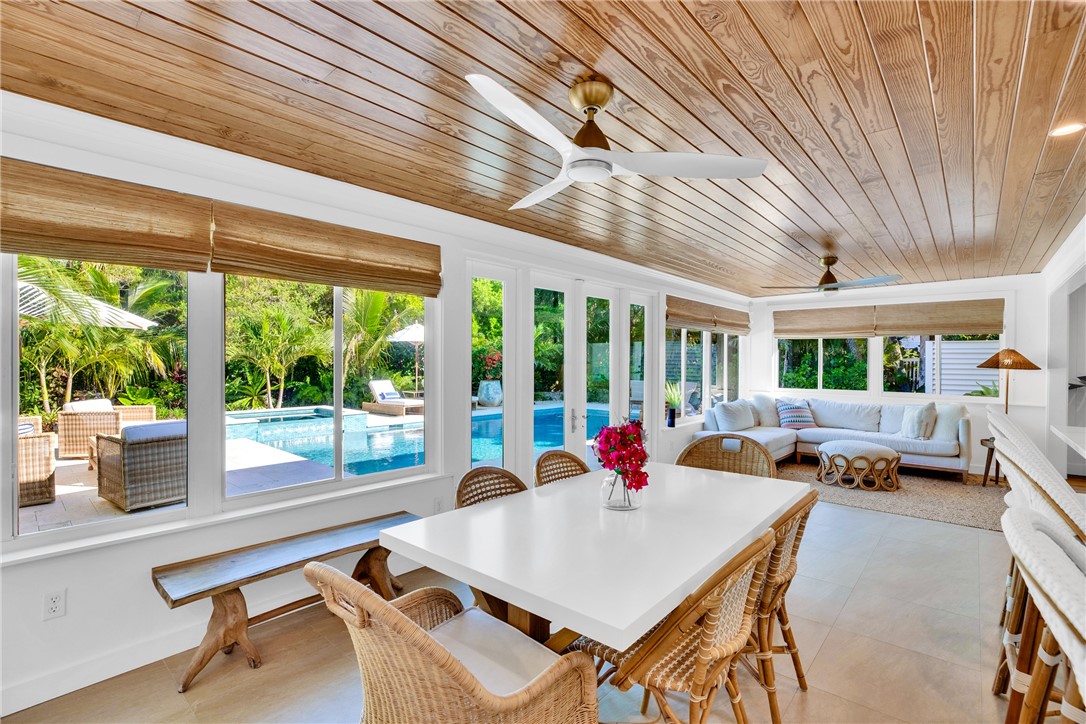 1830 East Sandpiper Road Vero Beach, FL 32963 - Photo 16 of 36 a living room with furniture and a large window