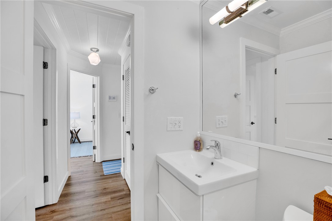 1830 East Sandpiper Road Vero Beach, FL 32963 - Photo 24 of 36 a bathroom with a sink and a mirror