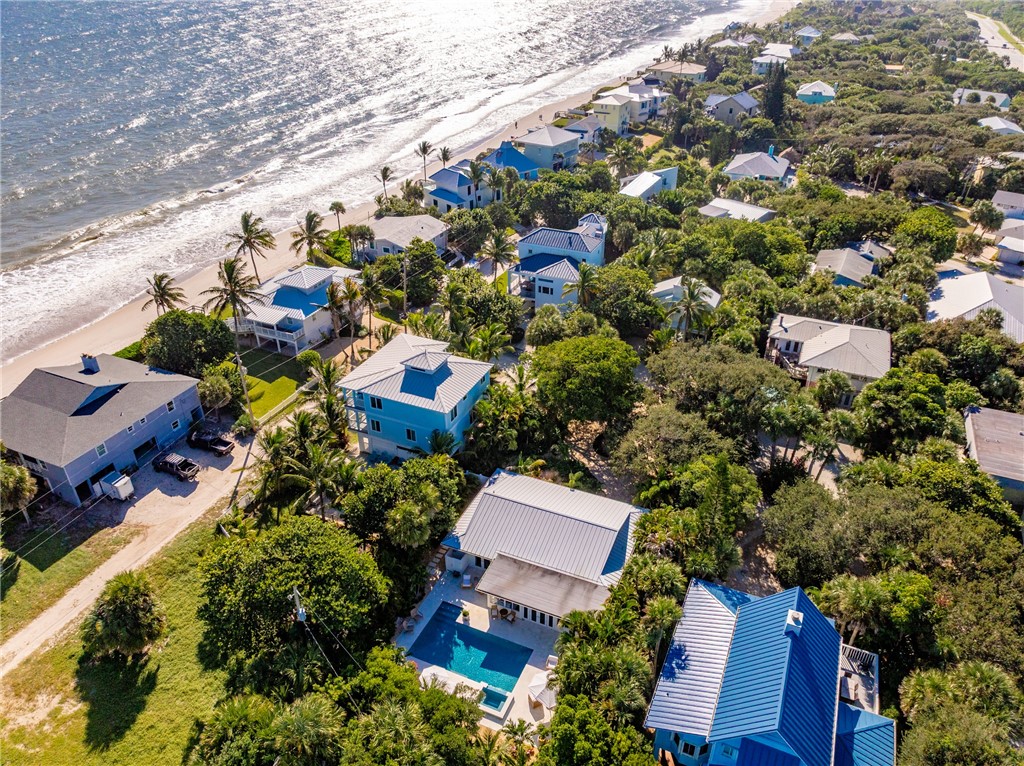 1830 East Sandpiper Road Vero Beach, FL 32963 - Photo 33 of 36 an aerial view of a house with a yard and outdoor seating