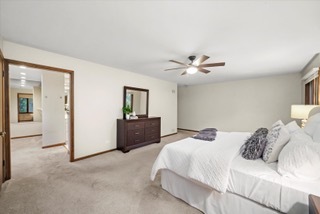2130 Mallard Drive Northbrook, IL 60062 - Photo 12 of 28 a bedroom with a large bed and a ceiling fan