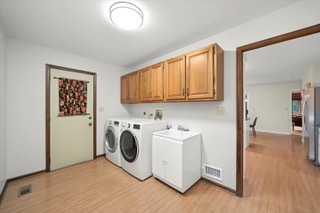 2130 Mallard Drive Northbrook, IL 60062 - Photo 19 of 28 a view of a storage & utility room with washer and dryer