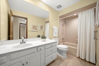 2130 Mallard Drive Northbrook, IL 60062 - Photo 21 of 28 a bathroom with a double vanity sink toilet mirror and bathtub