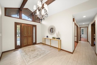 2130 Mallard Drive Northbrook, IL 60062 - Photo 5 of 28 a view of a livingroom with a furniture a chandelier and wooden floor
