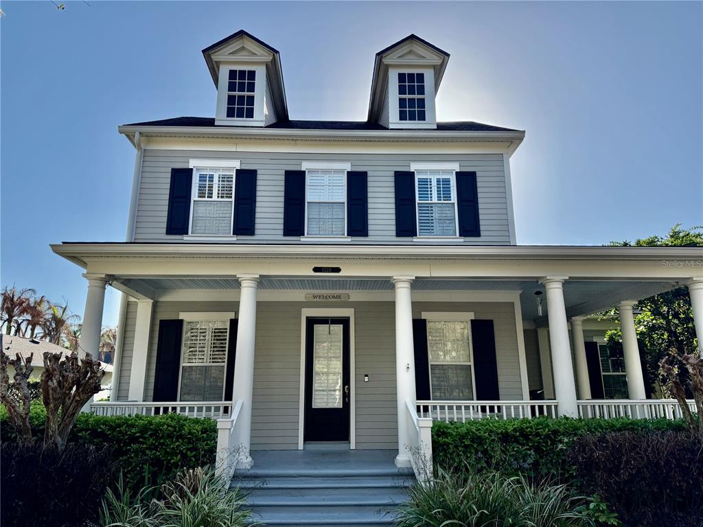 1328 Celebration Avenue Celebration, FL 34747 - Photo 1 of 26 front view of house with a yard