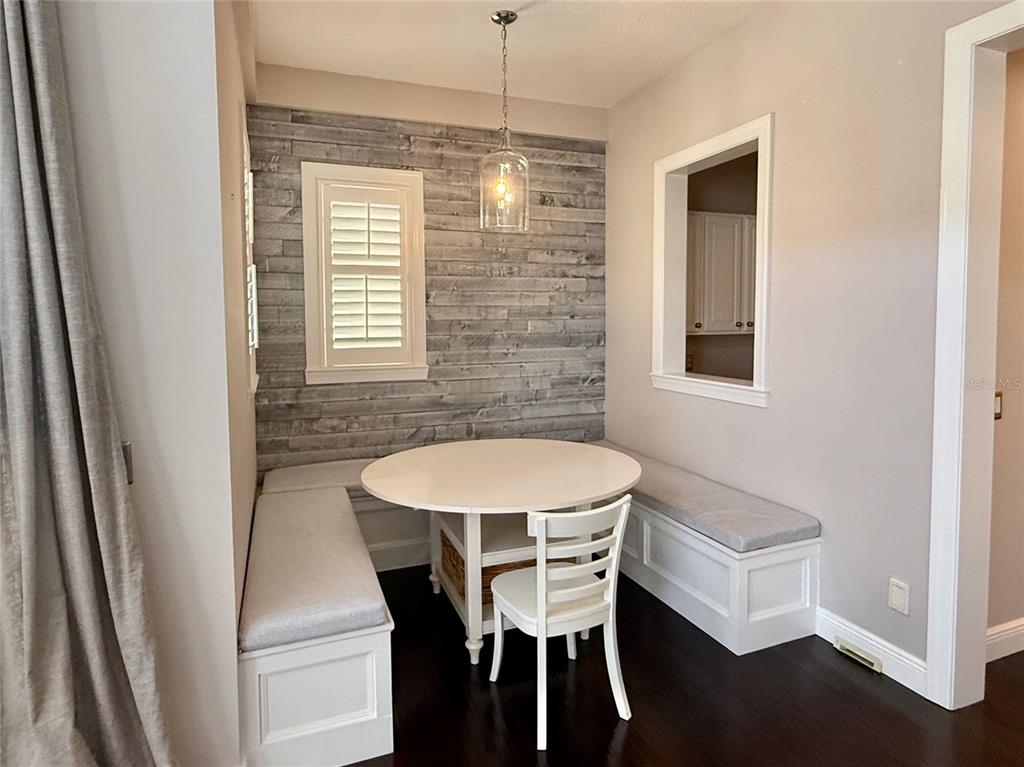 1328 Celebration Avenue Celebration, FL 34747 - Photo 11 of 26 a dining room with furniture and window