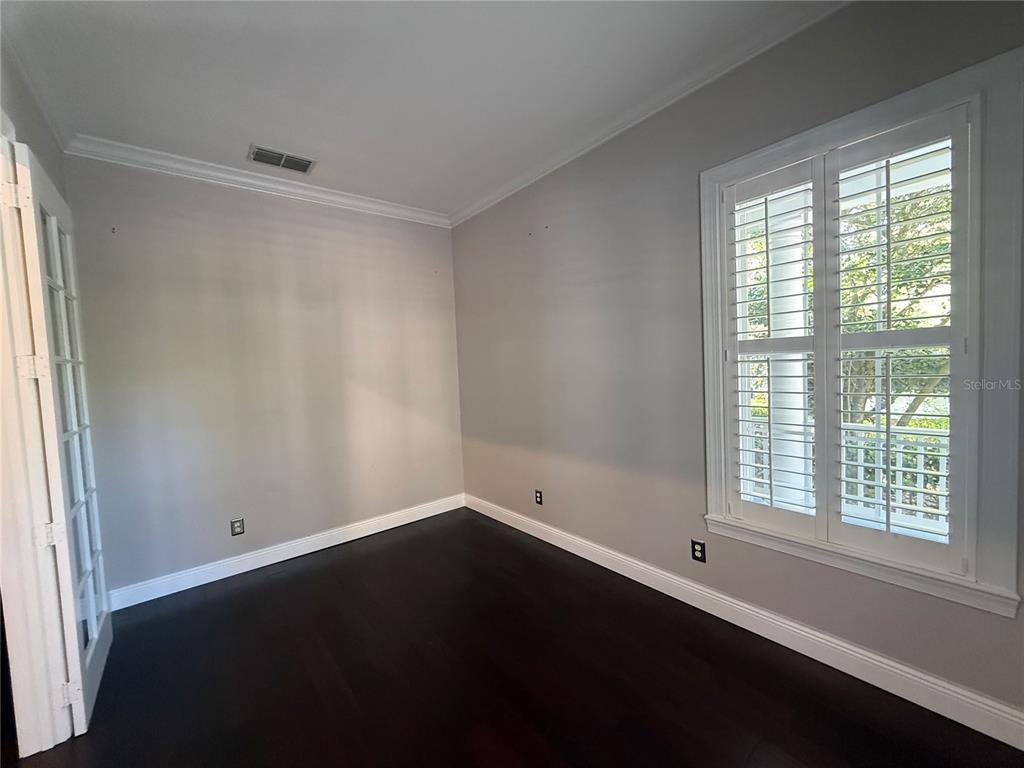 1328 Celebration Avenue Celebration, FL 34747 - Photo 15 of 26 an empty room with a window