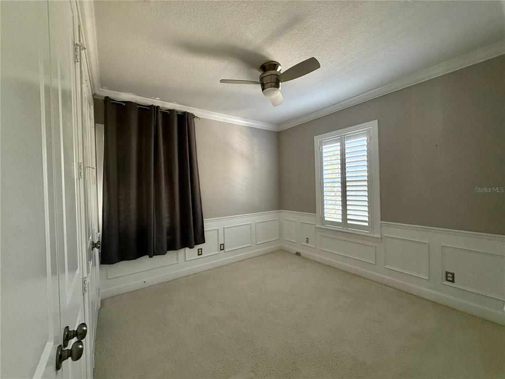 1328 Celebration Avenue Celebration, FL 34747 - Photo 21 of 26 a view of an empty room with a window