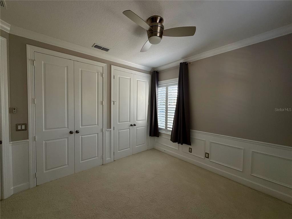 1328 Celebration Avenue Celebration, FL 34747 - Photo 22 of 26 wooden floor in an empty room with a window