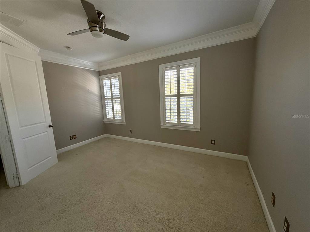 1328 Celebration Avenue Celebration, FL 34747 - Photo 23 of 26 a view of an empty room with a window