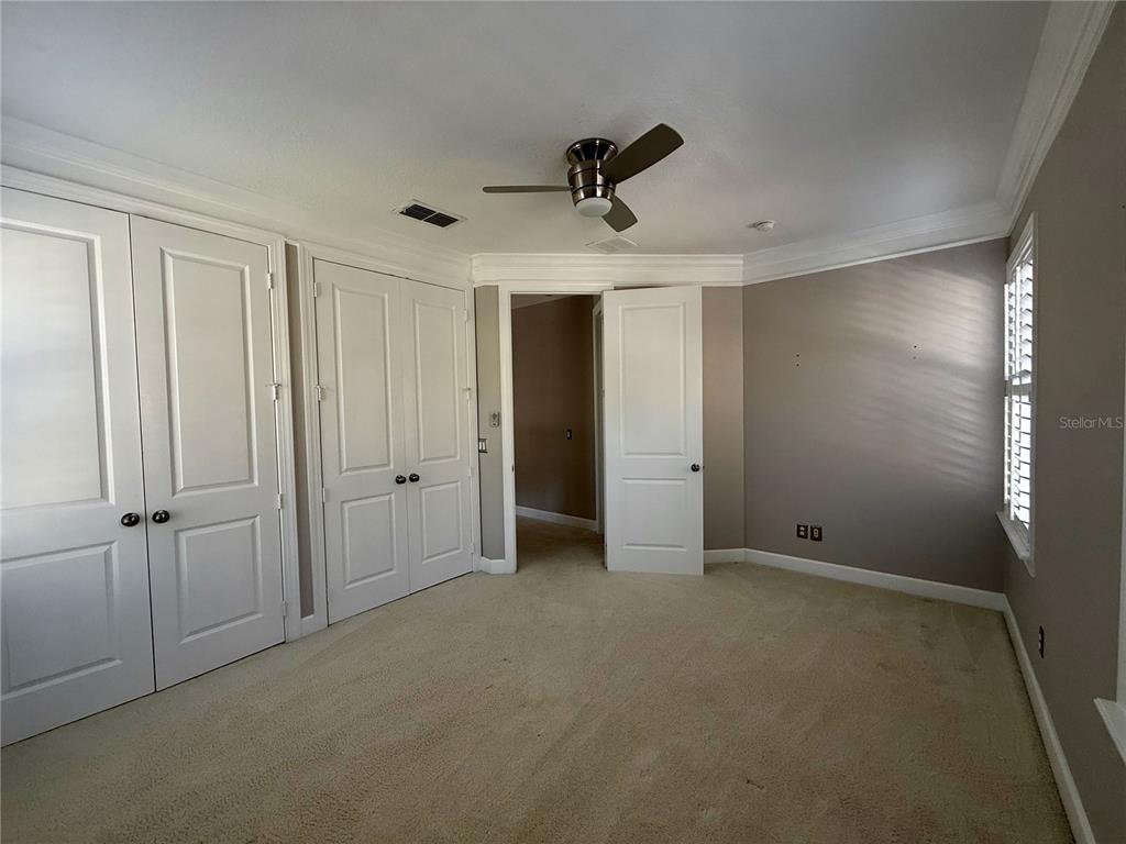1328 Celebration Avenue Celebration, FL 34747 - Photo 24 of 26 an empty room with a empty space and windows