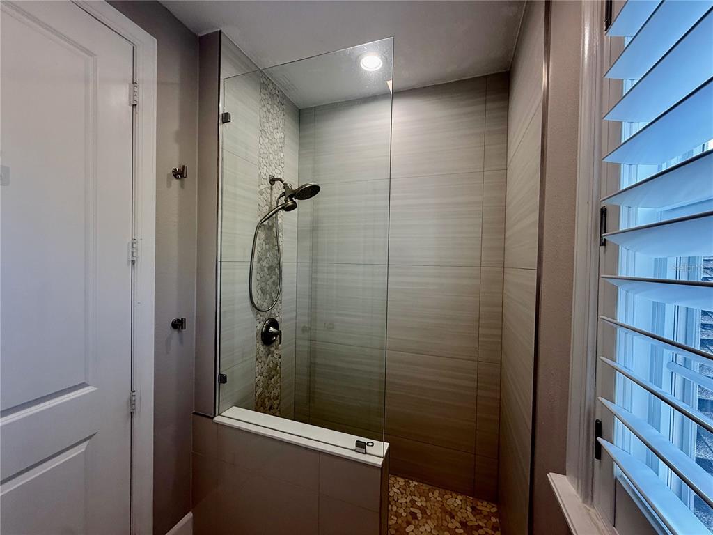 1328 Celebration Avenue Celebration, FL 34747 - Photo 25 of 26 a bathroom with a shower