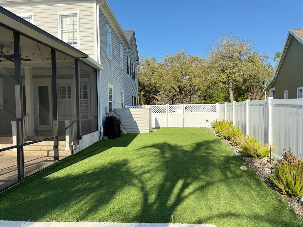 1328 Celebration Avenue Celebration, FL 34747 - Photo 4 of 26 a view of backyard with tub and trees