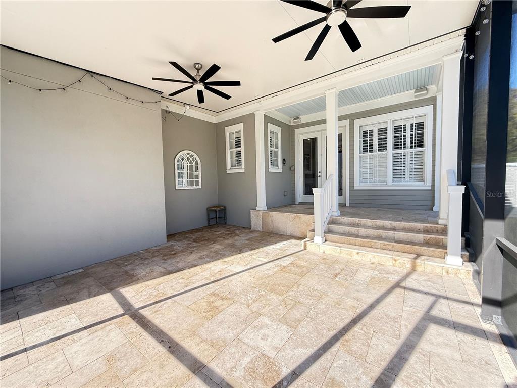 1328 Celebration Avenue Celebration, FL 34747 - Photo 5 of 26 a view of a hallway with a chandelier