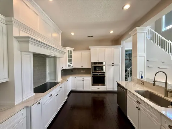 a bathroom with a sink a mirror and shower