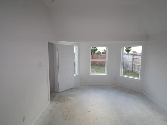 an empty room with windows