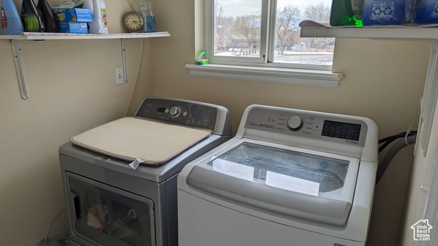 1341 East Crk Road Sandy, UT 84093 - Photo 21 of 24 Clothes washing area featuring washing machine and clothes dryer