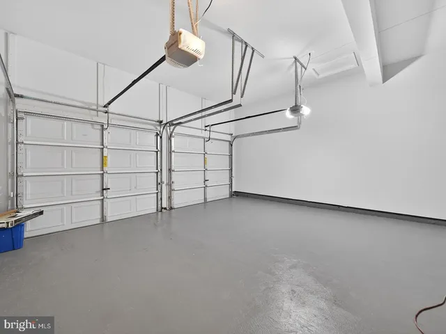 a large kitchen with stainless steel appliances granite countertop a stove and a sink